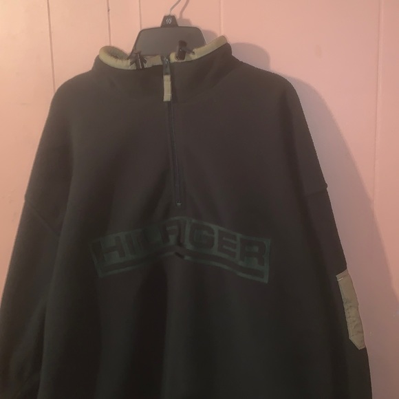This is a green and tan Tommy Hilfiger Quarter Zip Sweater, and it